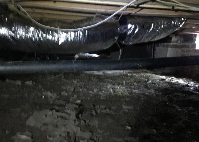 The crawl space of this home has the ductwork in the crawl space. By not having the crawl space completely sealed, the HVAC air steeps out of the ductwork and out of the home causing high energy costs.