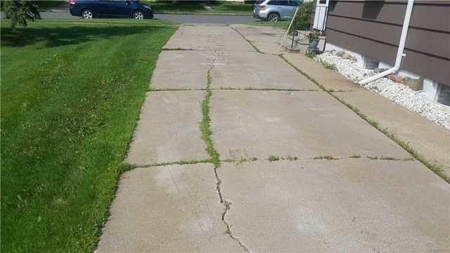 Badly Cracked Driveway in Hibbing, MN