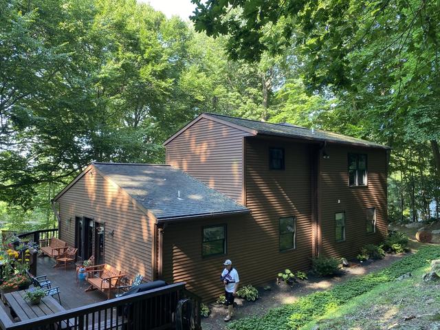 Side View of home with the old roofing materials.