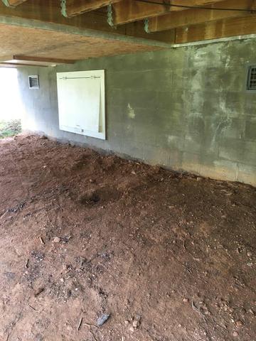 The mostly above ground crawl space wall made it a prime spot for water absorption.