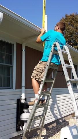 Bill ensures the pipe is level