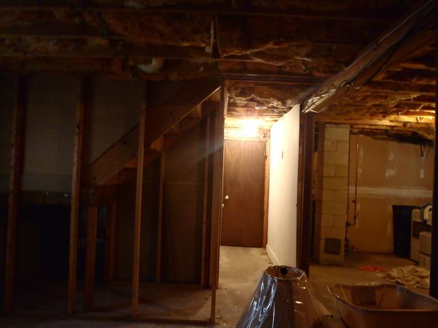 <p>Another hallway photo with an extended view of the rest of the basement.</p>