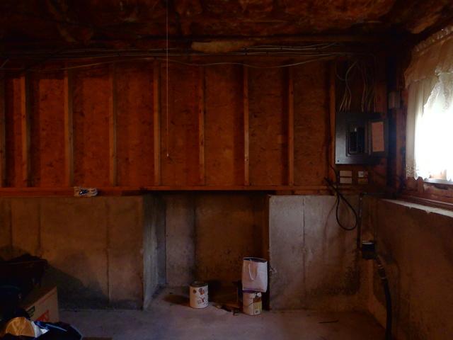Wall next to window.