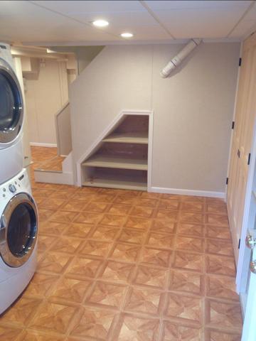 This laundry space is a huge improvement when compared to what it used to look like! How do you like that little sneak of shelving below the staircase? 