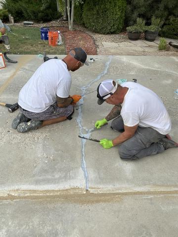 <p>Crew laying NexusPro Crack and Joint sealant</p>