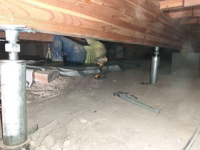 <p>Our crew is working hard to get the Smart Jacks installed an this home's crawlspace stabilized! This foundation repair comes with a tr5anferrable warranty.&nbsp;</p>