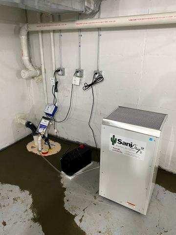 To complete the installation, our crew applied new concrete over the river rock and installed our SaniDry XP Dehumidifier next to the sump pump. Perry and Julie had a great experience from start to finish!