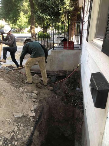 Our crew preparing to install helical piers