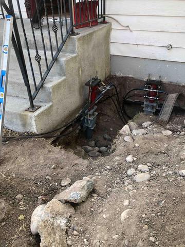 Once piers are driven into the bedrock, brackets are attached along with a hydraulic system that will lift the home until it is re-leveled.