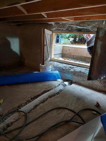 <p>A drain is added to the entrance of the crawlspace and is taken to the existing sump. The trench that was opened up will be concreted over</p>