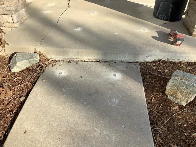 Before photo of sunken sidewalk leading to porch