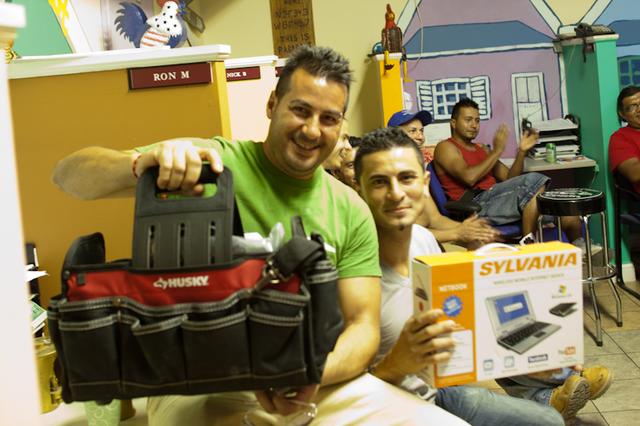 Jorge and Heriberto show off their prizes for best product knowledge and fastest TripleSafe assembly time.