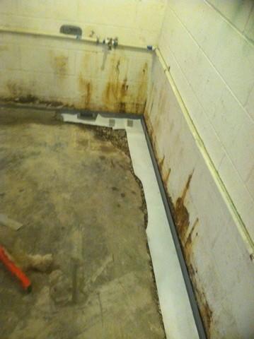 <p>An additional two sections of wall needed to have the Waterguard waterproofing system installed because groundwater was now being directed along the Garage. Total installed footage was 24' of Waterguard along the wall between the basement and garage.&nbsp;</p>