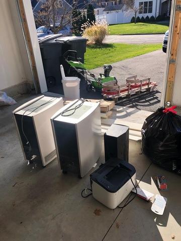 Old AC units, air purifiers, and other miscellaneous items the family no longer needed cluttering up the garage