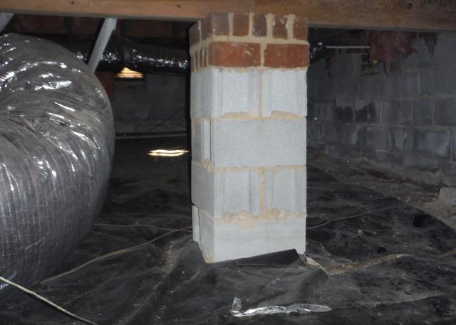 The liner in the crawl space before the CleanSpace Crawl Space Encapsulation System was thin and did not cover the complete crawl space from moisture entering from around the piers and along the foundation walls.