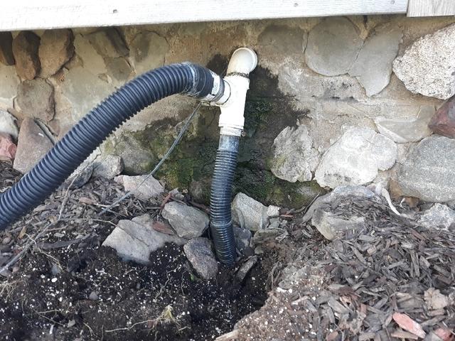 Our team will install a new discharge line here and bury it beneath the surface of the soil. Making sure that water is directed away from the foundation is important to keep it from returning into the basement.