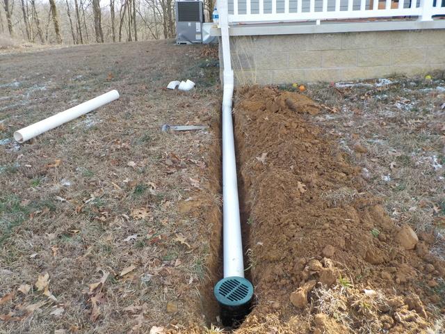 The drain line is one of the final steps and is designed to take all of the moisture that is collected from the crawl space out and away from the home.  This drain line is long enough and far enough away from the home to ensure the water cannot return.