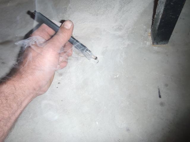 Mike Testing Floor Crack for Radon Gas