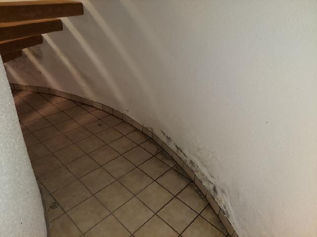 Water Damage Beneath Stairs