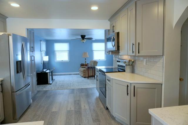 View of new flooring in living room & kitchen