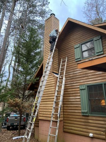 <p>Putting the finishing touches on the new siding.</p>