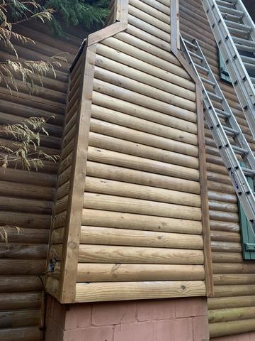 Newly installed log cabin siding