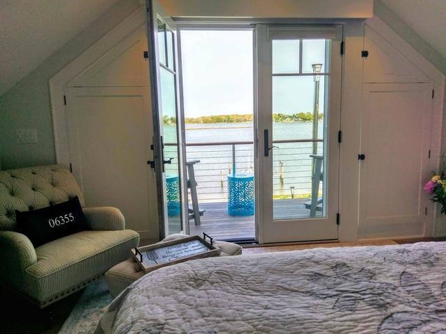 Upstairs bedroom with balcony.