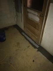 A french drain in front of a door