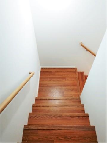 For consistency, our homeowners decided to work with the mahogany colored MillCreek™ flooring all throughout their finished basement, starting with the staircase.