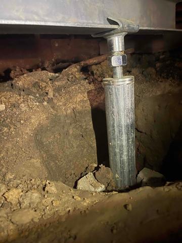 SmartJacks installed to lift and stabilize the failing floor joists in the crawl space