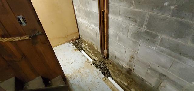 Starting to Lay Piping and Gravel Along The Left Wall and Storage Area