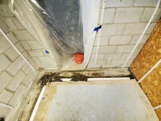 Starting to Lay Piping and Gravel Along The Right Wall and Storage Area