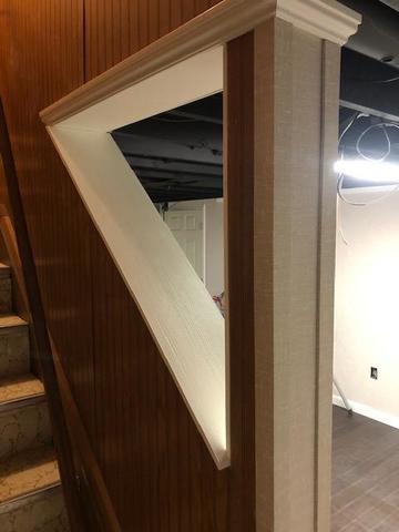 <p>The stairway was refinished on the basement side as a part of this project. You can see the clean lines that our finishing processes create.</p>