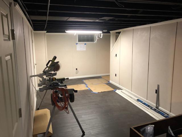 The EverLast Wall Systems are being finished, the ceiling has been painted, and the ThermalDry Elite Plank Floors have been installed. Our electrician will be in soon to wire for the new recessed lighting and to install the new outlets for the room.