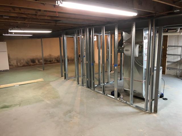 At the beginning of the project our Installation Crew lays tracks and puts up metal frames for the EverLast Wall Panels to be installed on.