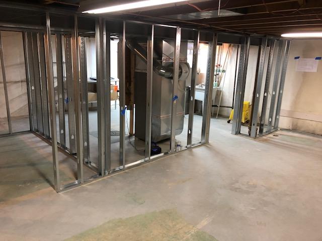 At the beginning of the project our Installation Crew lays tracks and puts up metal frames for the EverLast Wall Panels to be installed on.