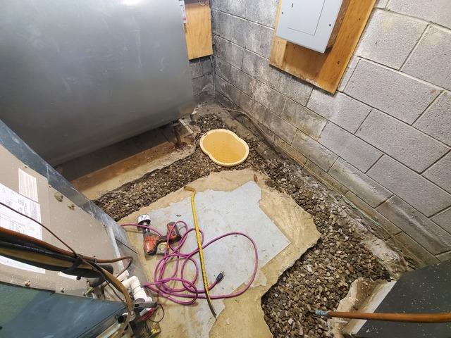 Piping and Gravel Laid From Newly Installed Sump Pump To The Boiler