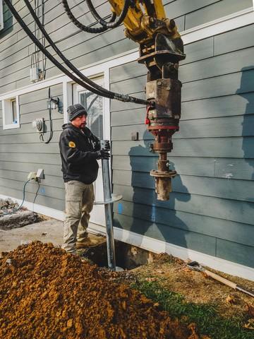 Our crew is in the process of installing our Helical Piers. These piers will help raise the foundation back to its original position and stabilize the home.