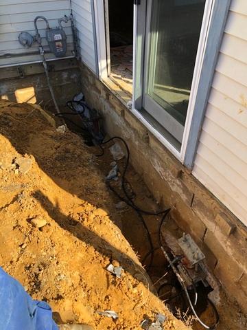 These are the helical piers being installed. Each pier is placed beneath the footing of the foundation to lift and stabilize the home.