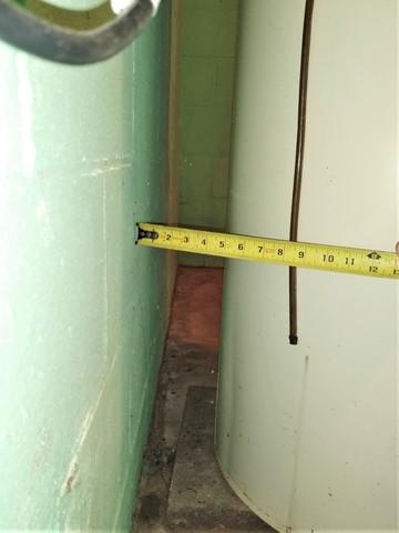 Narrow Space Between Water Heater and Basement Wall