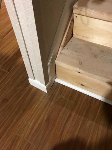 <p>The basement is finished with our EverLast Wall Panels being appropriately trimmed and the baseboards being added next to our ThermalDry Elite Plank Flooring. The new stairs look clean, bright, and ready to be a safe passage for the homeowners for many years to come.</p>