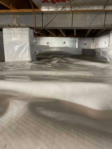 CleanSpace Vapor Barrier installed on the crawl space floor and SilverGlo installed on the crawl space walls to provide an effective encapsulation system