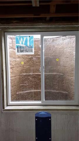 Window WellDuct captures water from wall crack and sends to sump pump