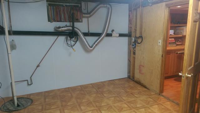 Here you see by adding BrightWall and ThermaDry floor this basement room is transformed