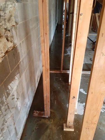 This photo shows how water was able to leak through the concrete block walls into the basement, creating a moisture issue.