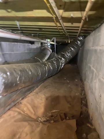 This home had clear plastic tarp as a vapor barrier, but unless it is sealed, the moisture still enters the space anyway.