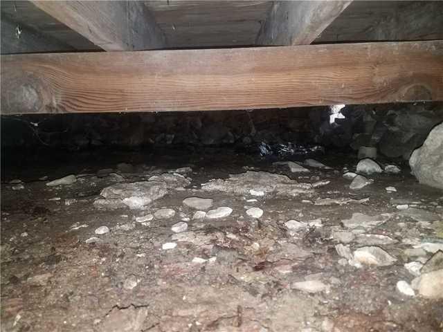 Damp and Dirty Crawl Space Before