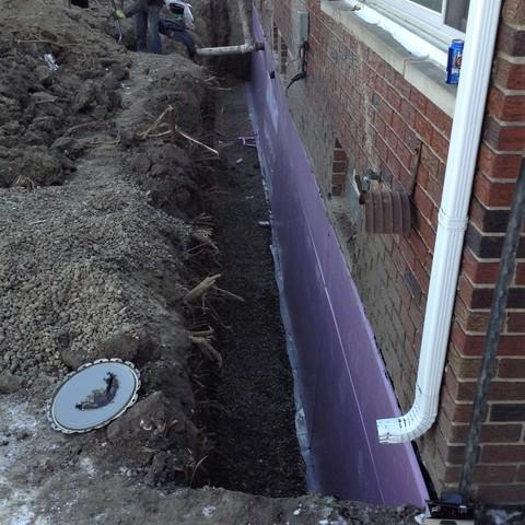 Bowing, Cracked, Leaky Foundation Wall Repaired in Caro, MI