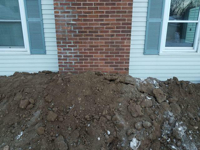 Our Crew Excavates Soil Around the Foundation