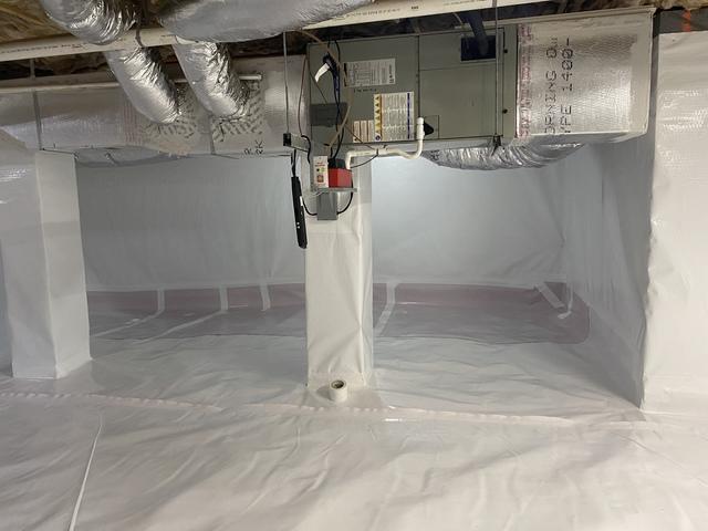 We ran our CleanSpace vapor barrier along the floor and up the walls to hold back water vapor from all sources.